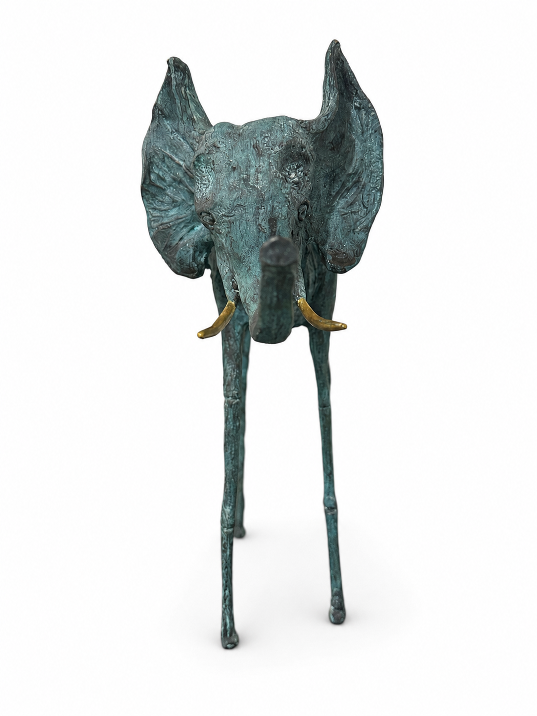 green bronze elephant sculpture with a gold saddle on a white background. Front view.
