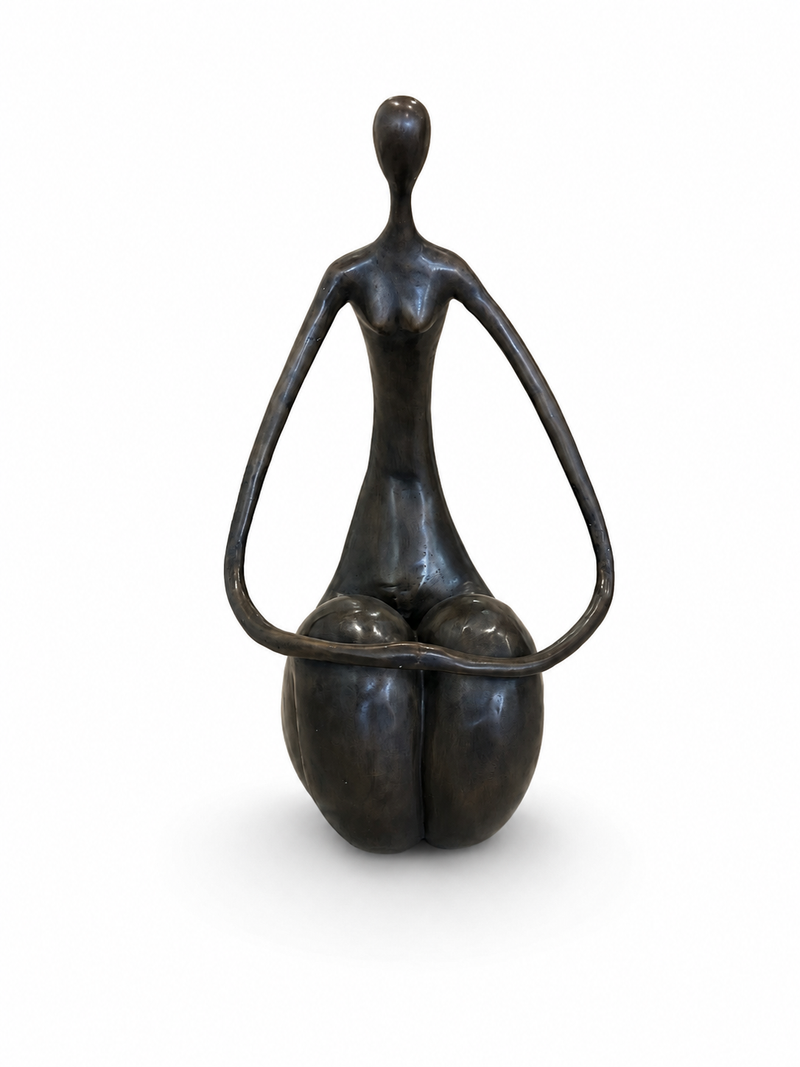 Bronze sculpture of a sitting and holding hands abstracted figure on a white background