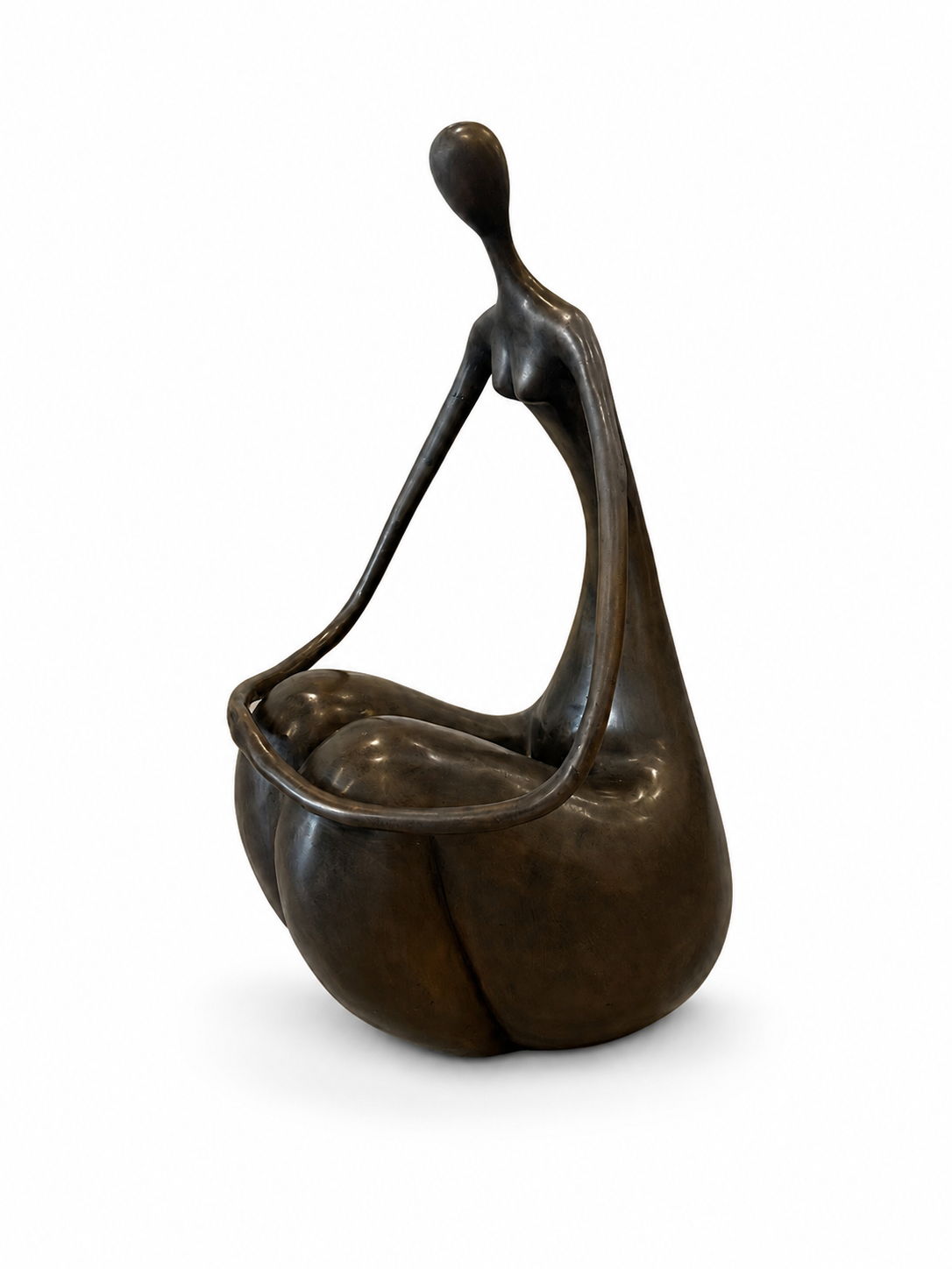 Bronze sculpture of a sitting and holding hands abstracted figure on a white background. Side view