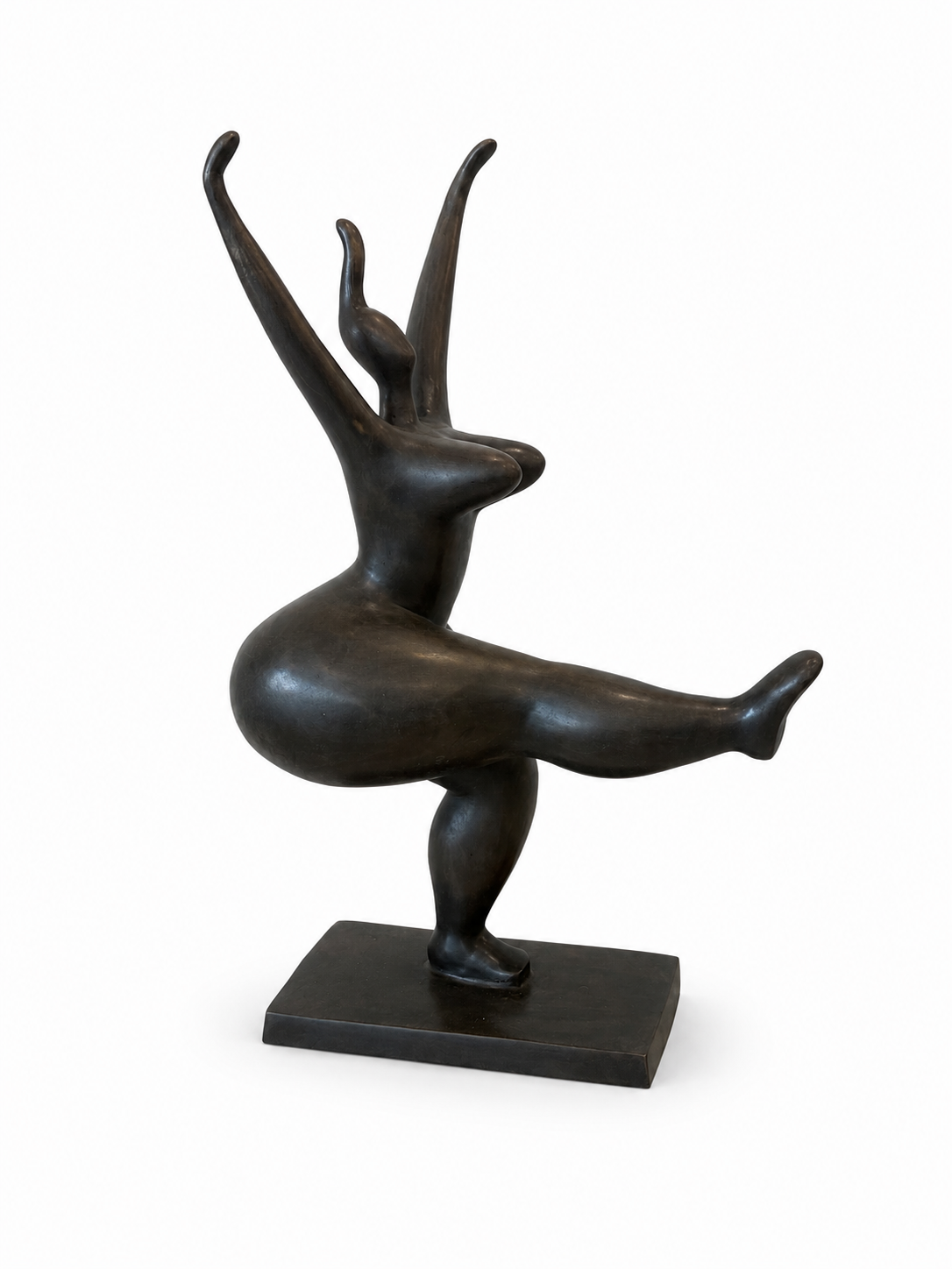 Bronze sculpture of abstracted standing lady with one leg up and both hands up on a white background. Side View