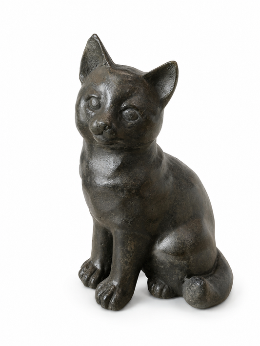 Bronze cat figurine on a white background