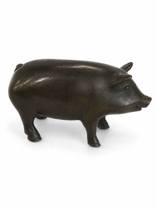 Bronze chubby pig figurine on a white background