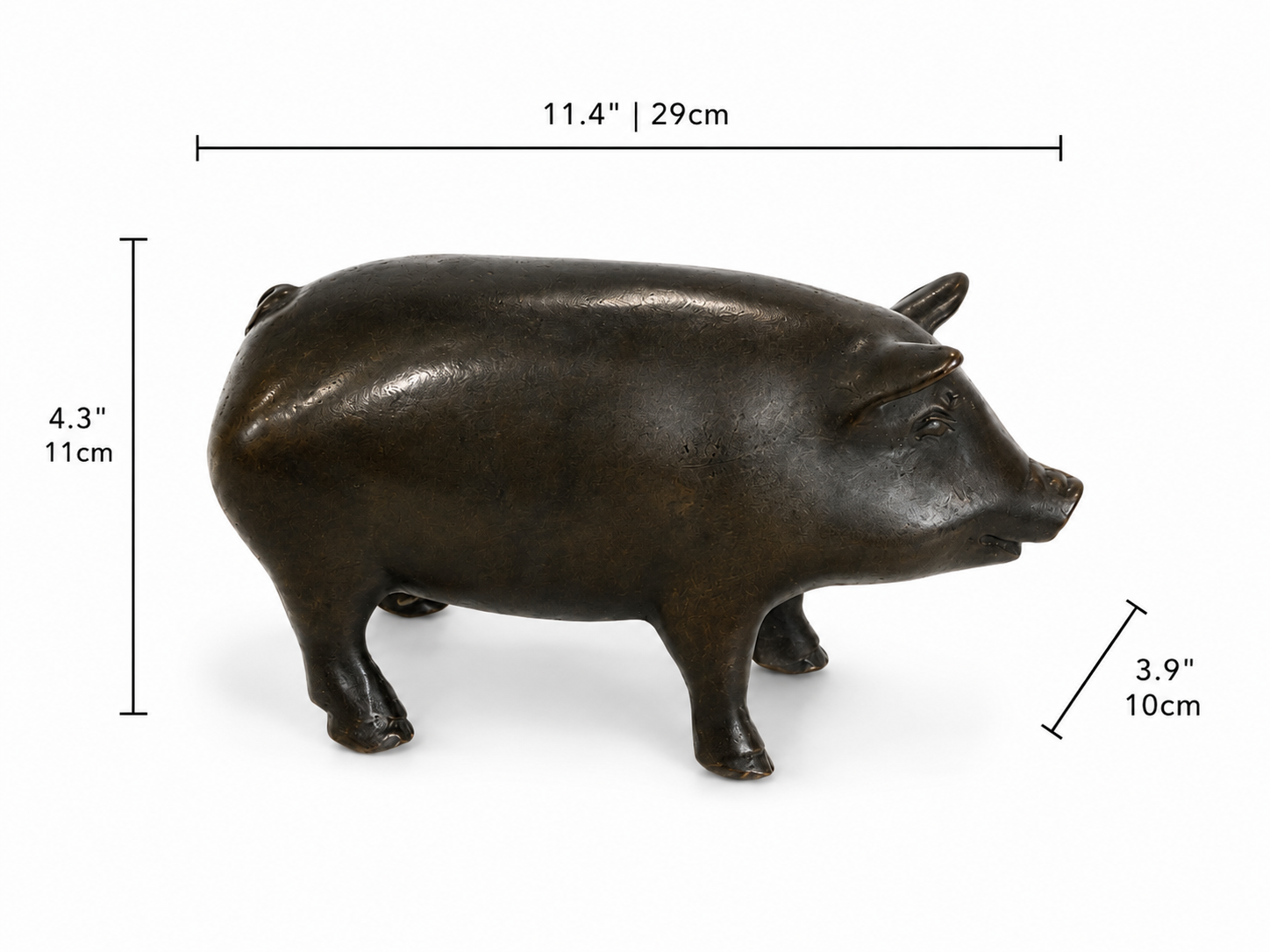 Bronze pig statue with dimensions indicated on a white background. Height 4.3 inches and 11cm. Width 3.9 inches and 10cm. Length 11.4 inches and 29cm. 