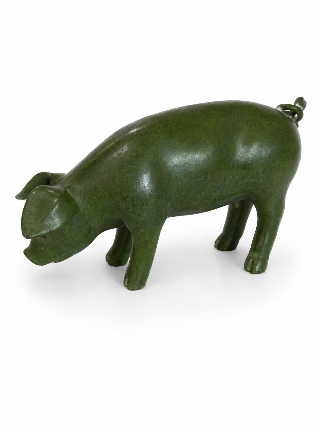 Green pig-shaped object on a white background. Side view flipped. 