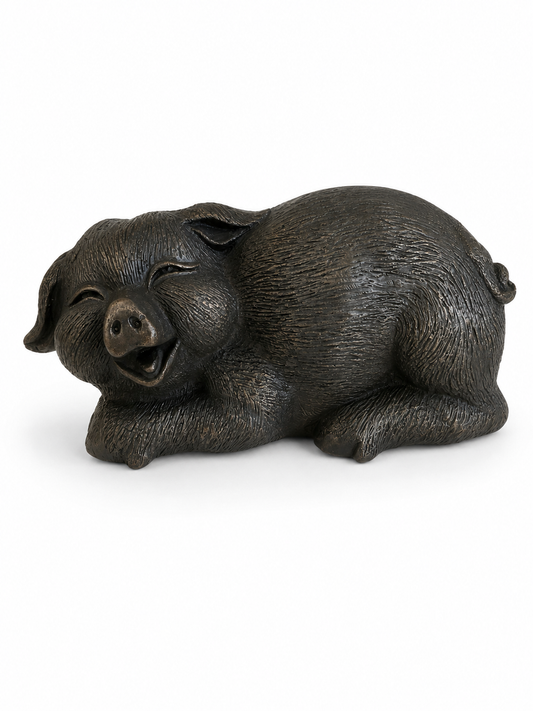 Bronze smiley pig figurine on a white background