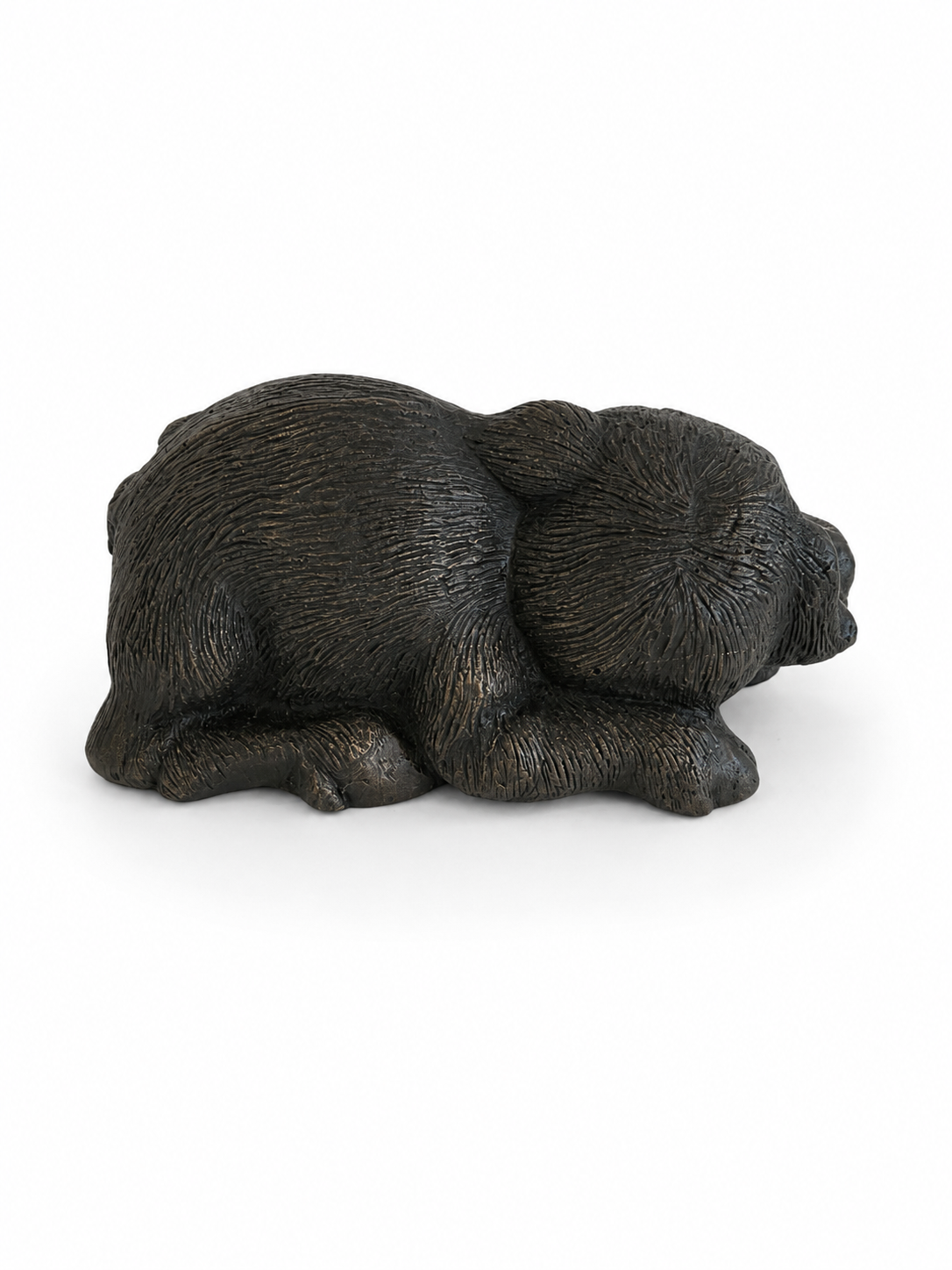 Black pig bronze sculpture on a white background. Back view.