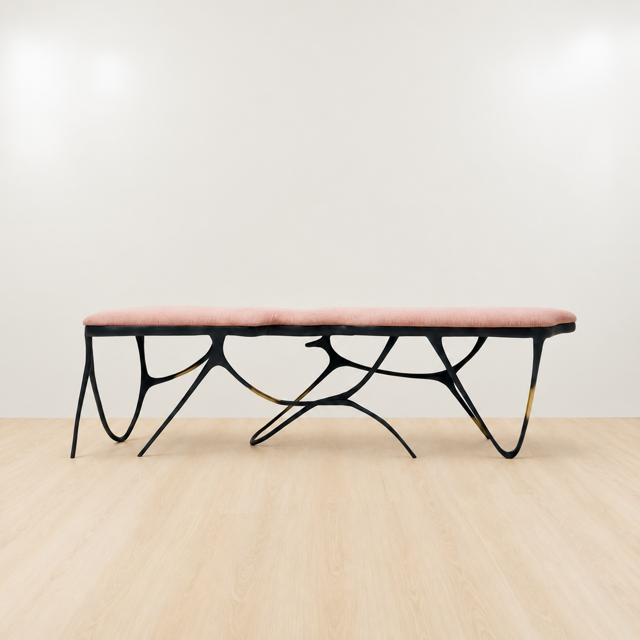 Black brass luxury handmade furniture bench with light pink velvet cushion with modern design, ideal for modern luxury decor, on a white background. Side angle