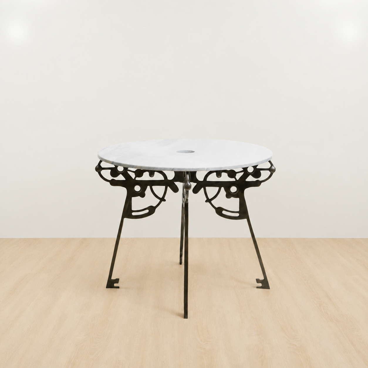 Small round table with white marble top and black brass base 