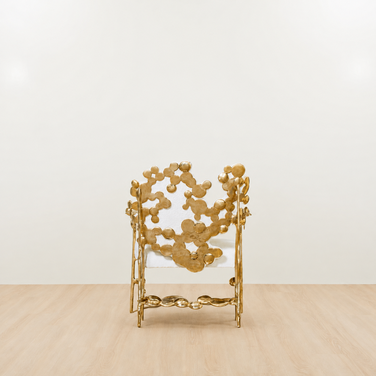 gold brass polished chair with white cushion on a beige floor and light beige wall. back view.