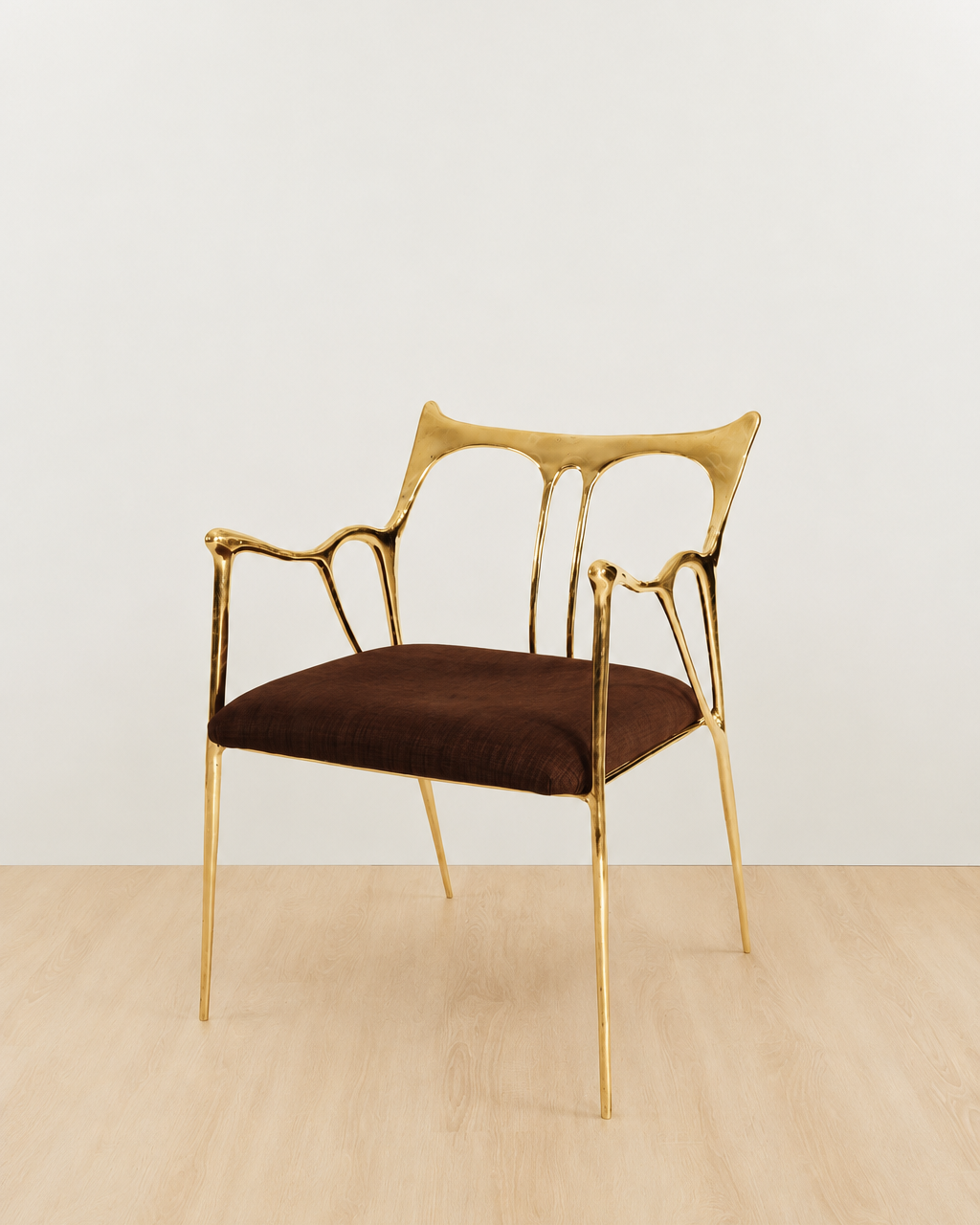 brass Chair with gold frame and brown cushion on a white background