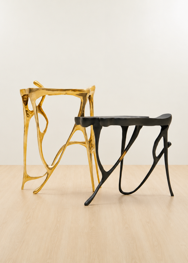 Gold and black modern brass side tables.