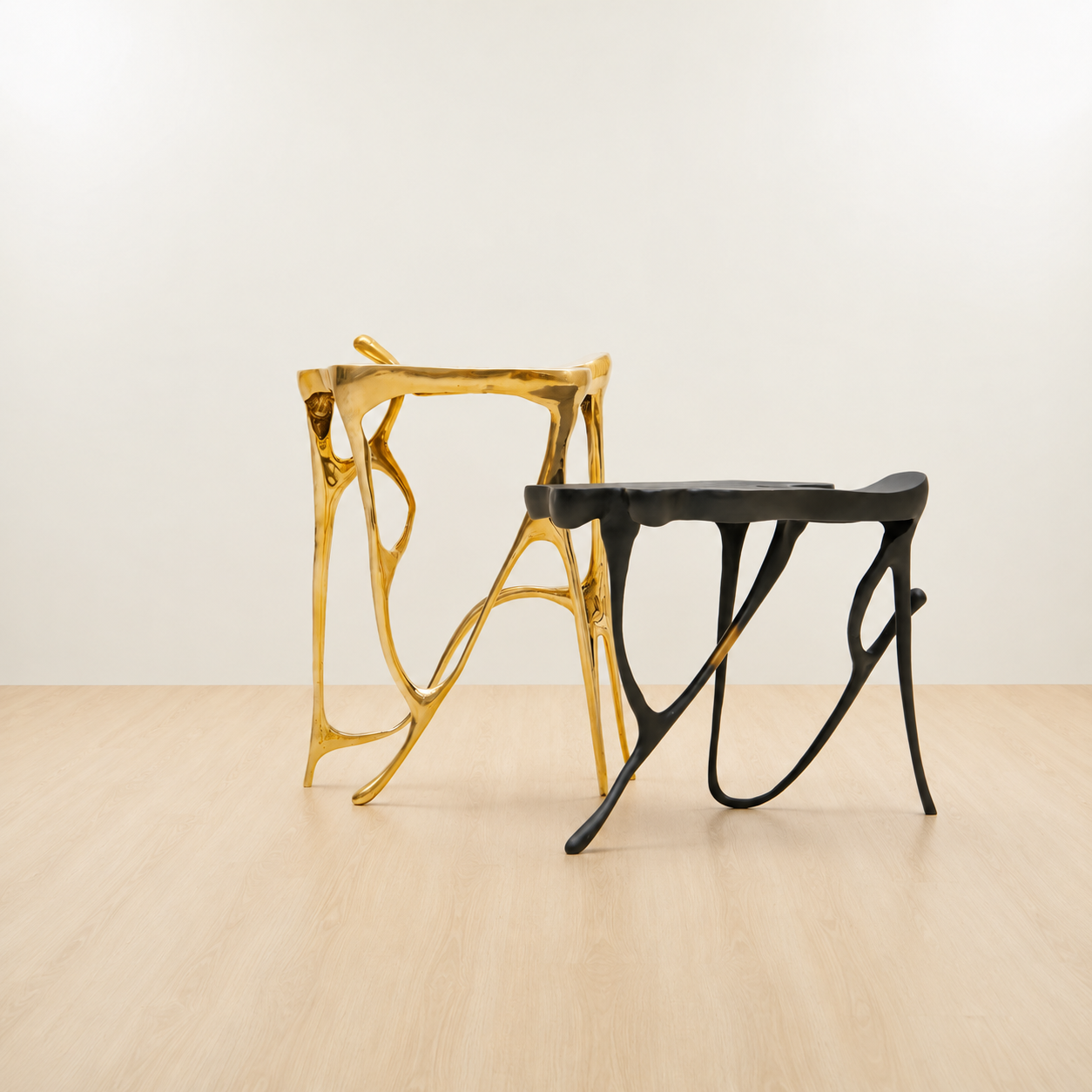 Gold and black modern brass side tables.