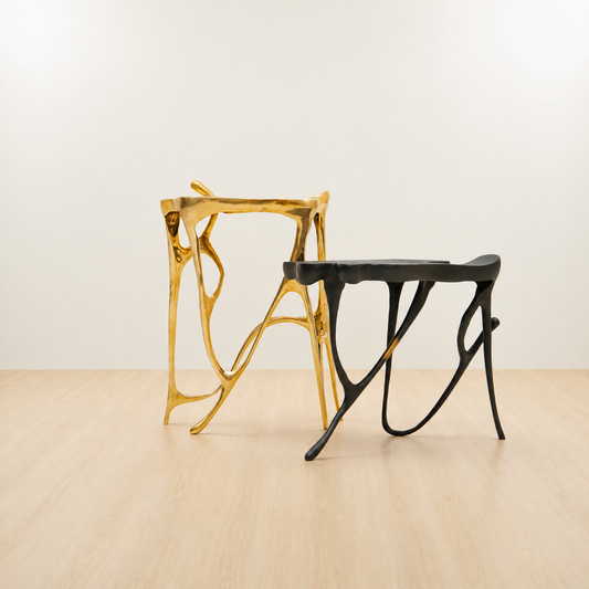 Gold and black modern brass side tables.