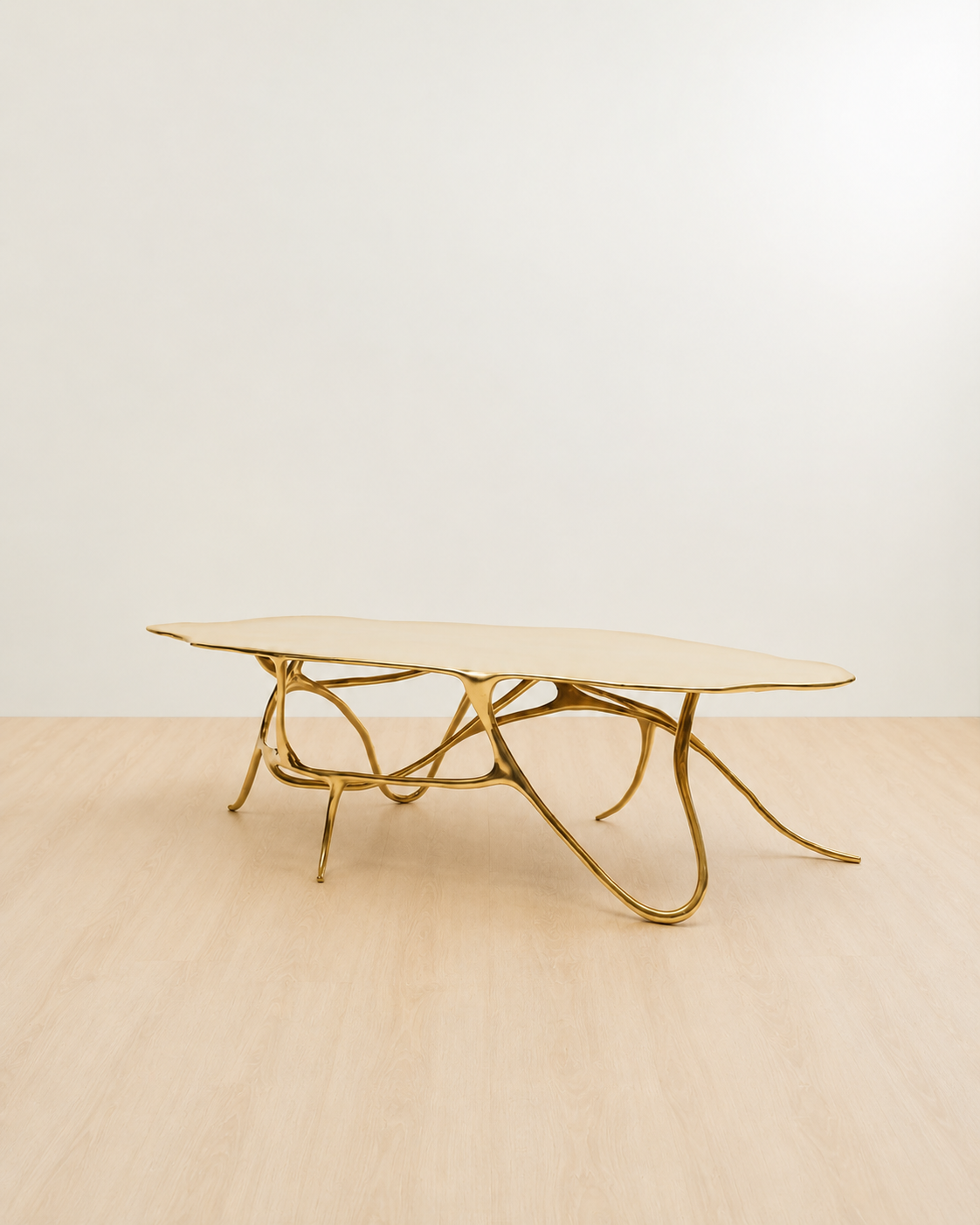side view of a polished brass (gold) coffee table