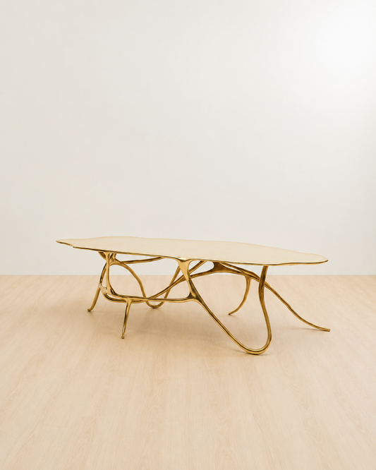 side view of a polished brass (gold) coffee table