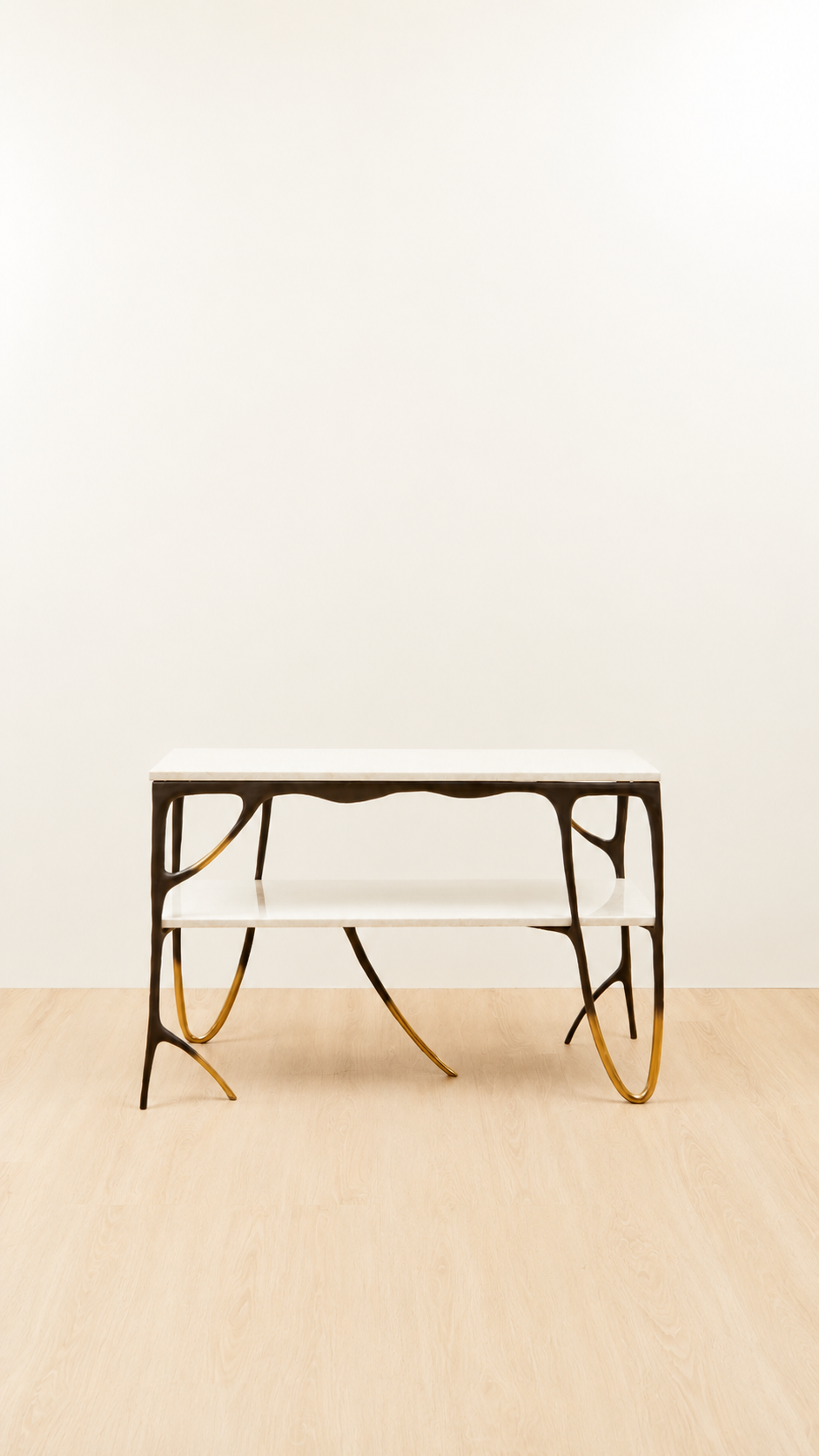 straight view of a two tiered console table with gold tips and two white marble tops