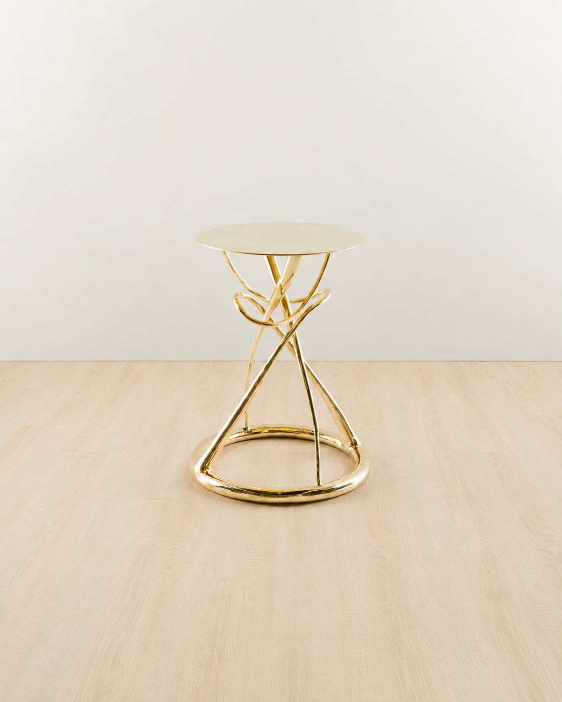 straight view of Gold brass side table with an hourglass design.