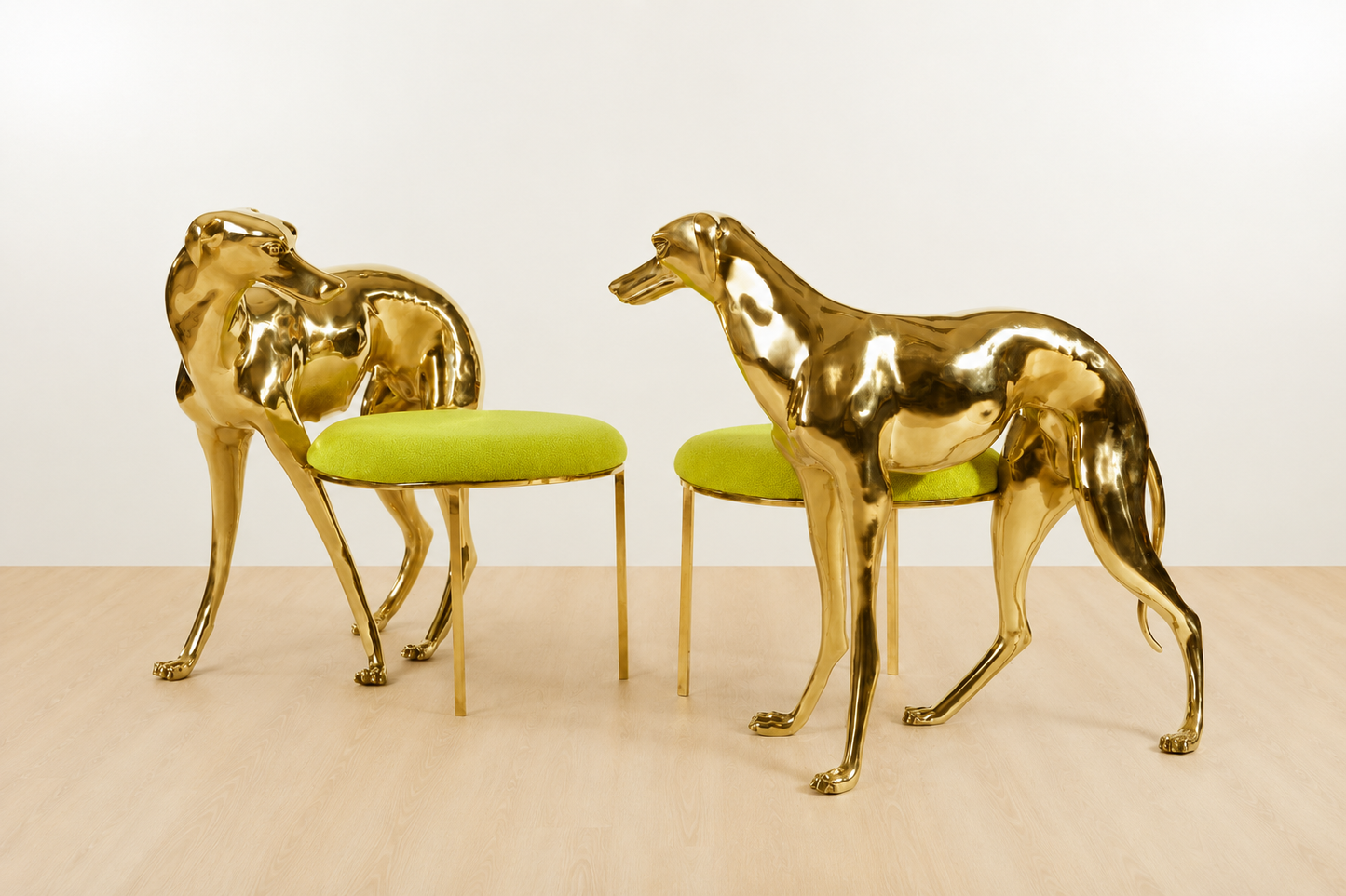 Two gold brass luxury handmade furniture dog-shaped chairs with neon yellow cushioned seats, ideal for modern luxury decor, on a white and beige background.