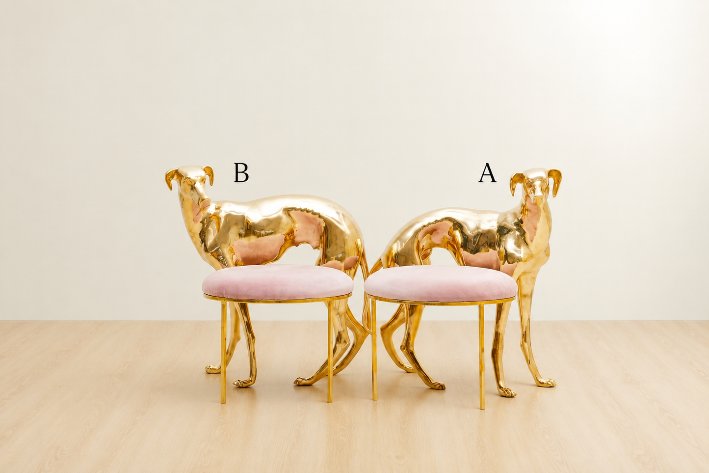 Two brass gold dog chairs with pink cushions on a beige floor and light beige wall.