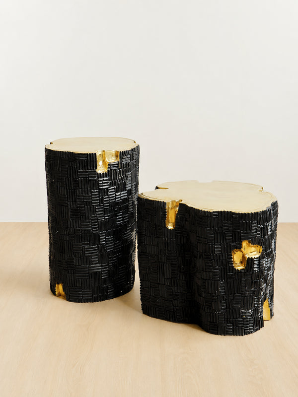 black brass side tables with textured bases and organic shaped tops