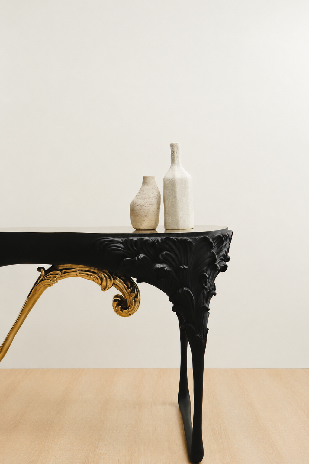 Black ornate table with two white vases 