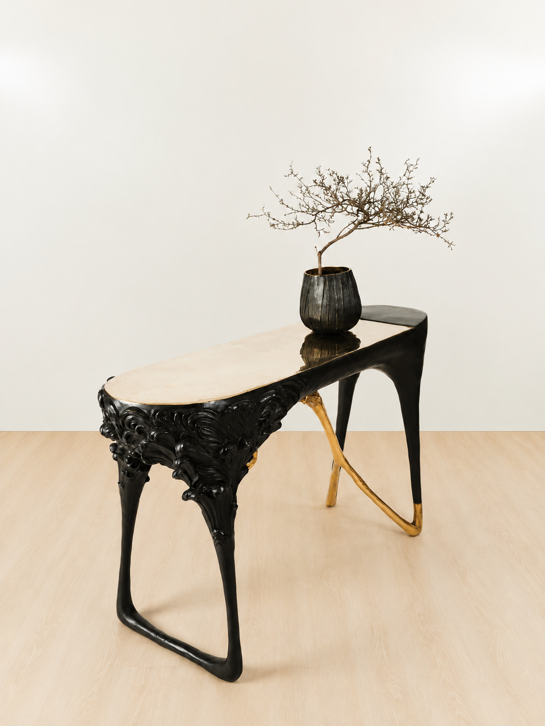 side view of Black brass console table with gold legs 