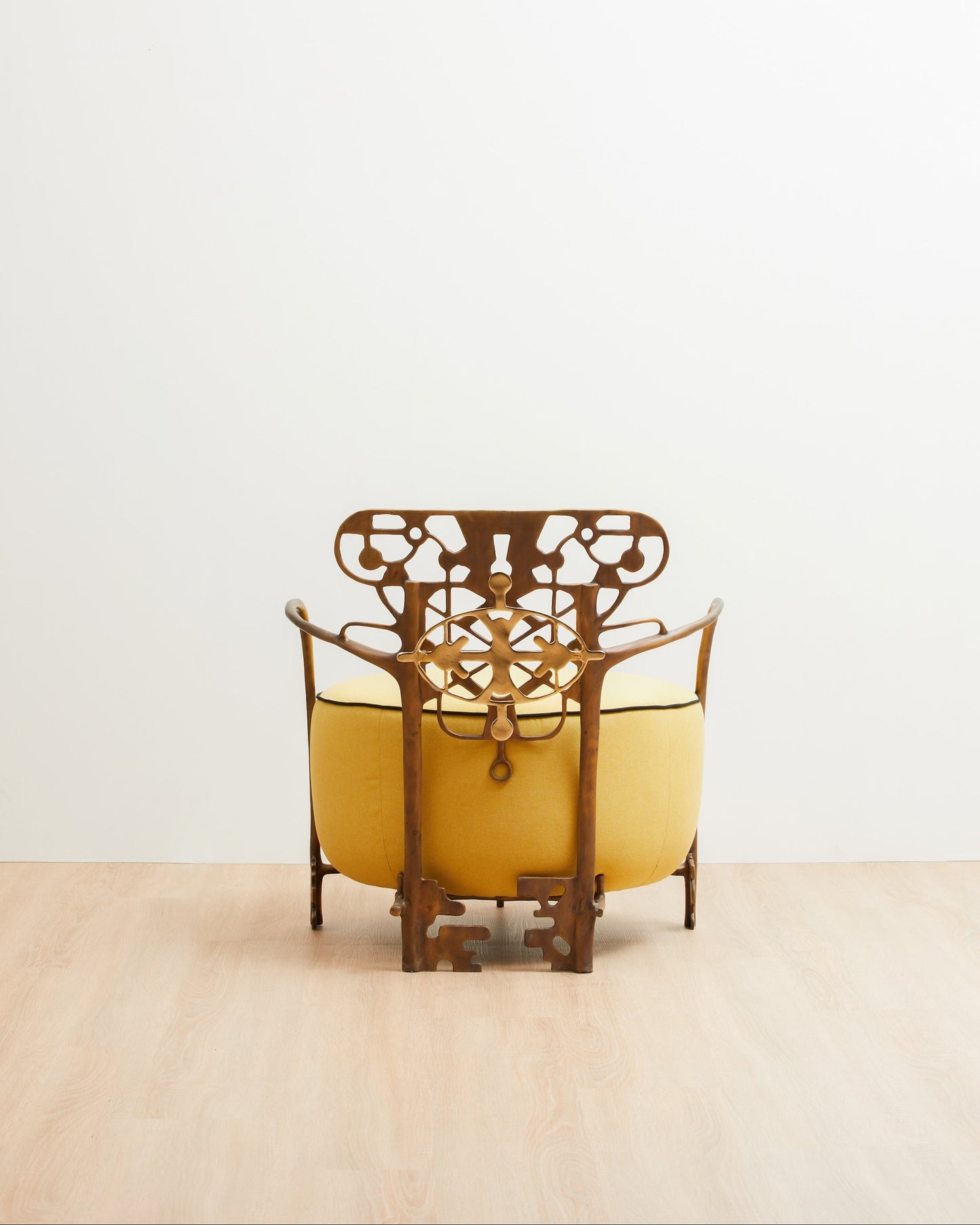 Yellow chair with intricate backrest design on a light gray background. Luxury handmade furniture