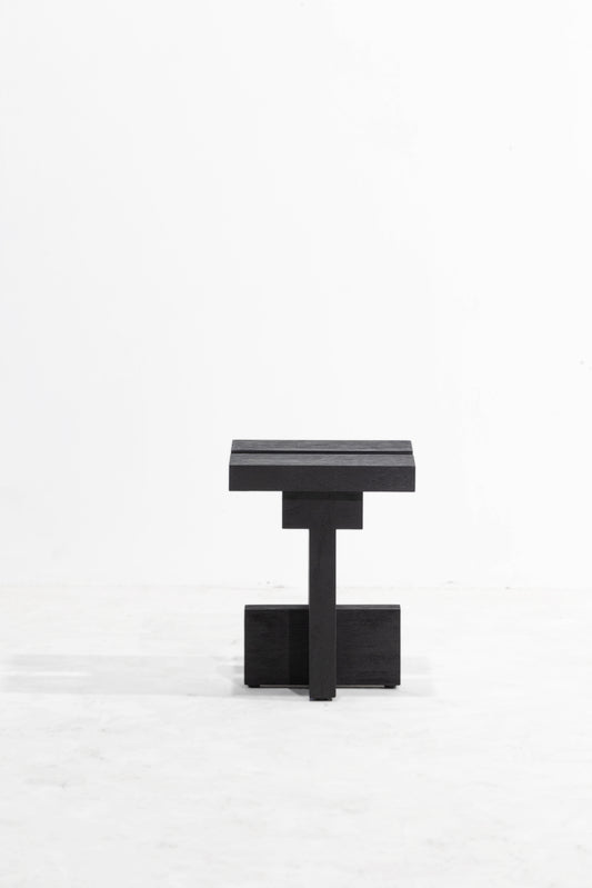 Namu side table. A minimalist black wooden side table with a geometric, blocky design, photographed against a clean white studio background.