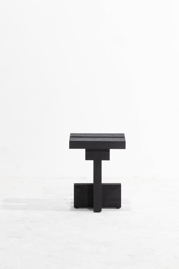 Namu side table. A minimalist black wooden side table with a geometric, blocky design, photographed against a clean white studio background.