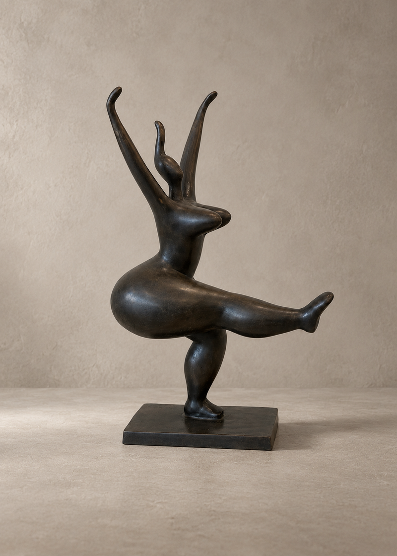 A dark bronze sculpture of a stylized rabbit-like figure with elongated ears and one raised leg, mounted on a rectangular base against a warm beige studio backdrop.