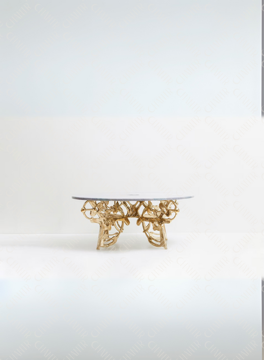 Gold brass luxury handmade furniture coffee table with decorative base, perfect for modern luxury decor, on a white background.