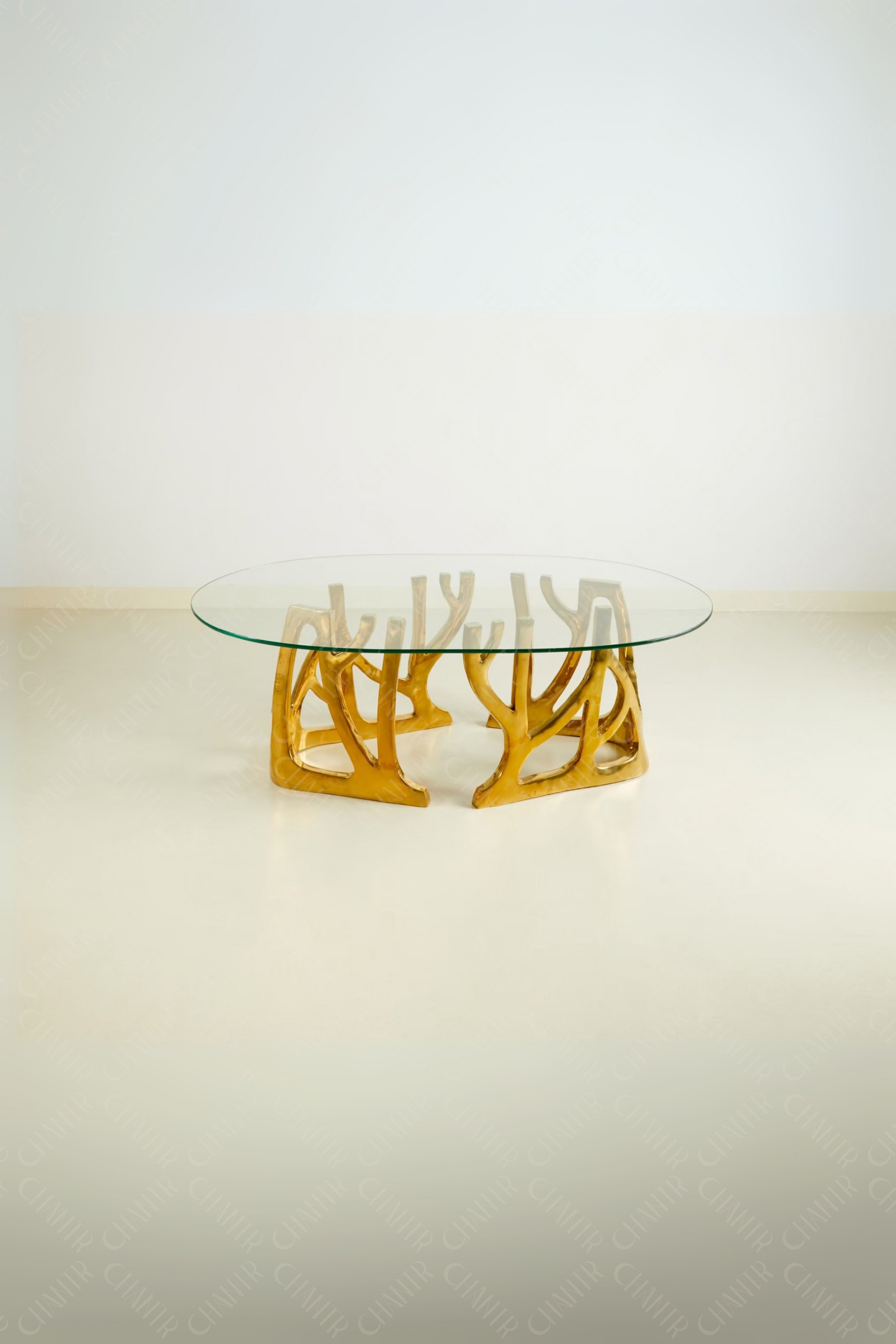 Glass table with gold brass luxury handmade furniture base, perfect for modern luxury decor, on a white background.