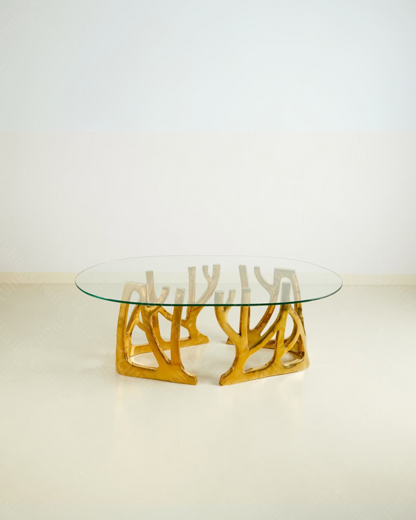 Glass table with gold brass luxury handmade furniture base, perfect for modern luxury decor, on a white background.