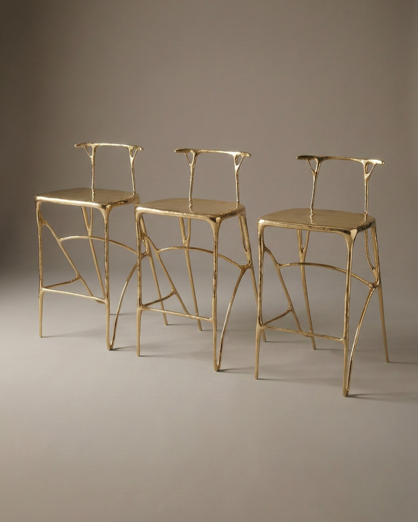 Custom brass bar stools with gold finish.