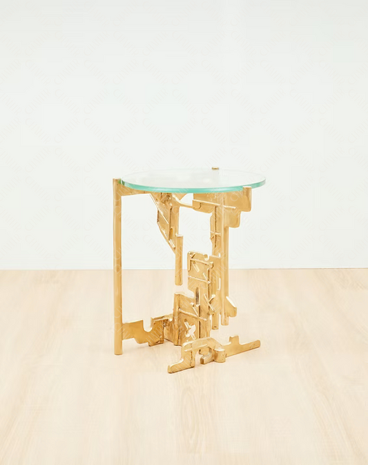 Gold brass luxury handmade furniture side table with glass top, perfect for modern luxury decor, on a beige surface with white background.