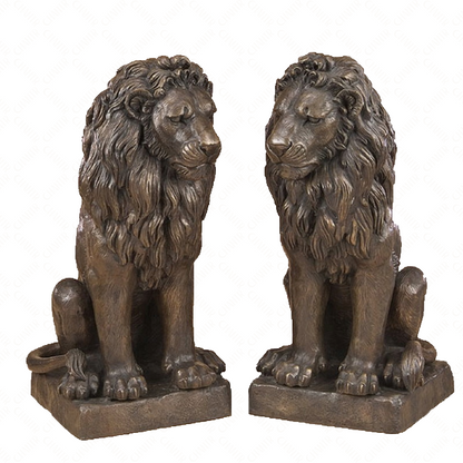 Two bronze luxury handmade furniture lion statues in a sitting pose, perfect for modern luxury decor, on a white background.