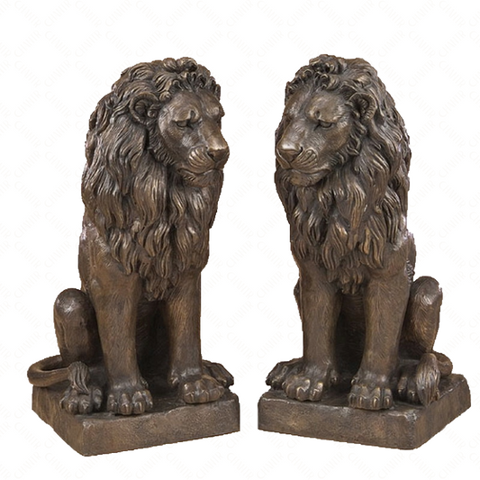 Two bronze luxury handmade furniture lion statues in a sitting pose, perfect for modern luxury decor, on a white background.