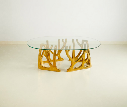 Glass table with gold brass luxury handmade furniture base, perfect for modern luxury decor, on a white background.