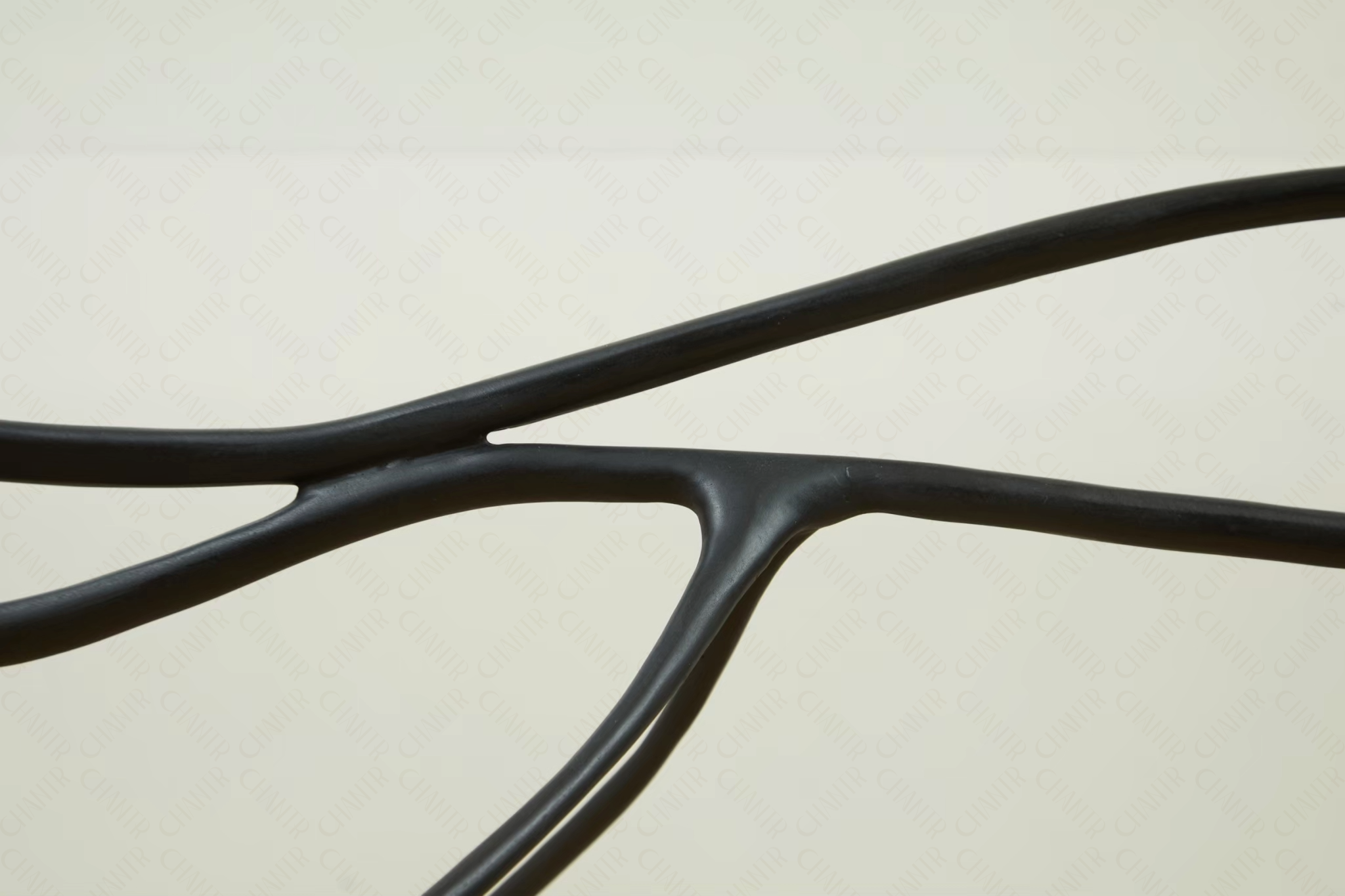 Close-up of black brass furniture strokes on a white background