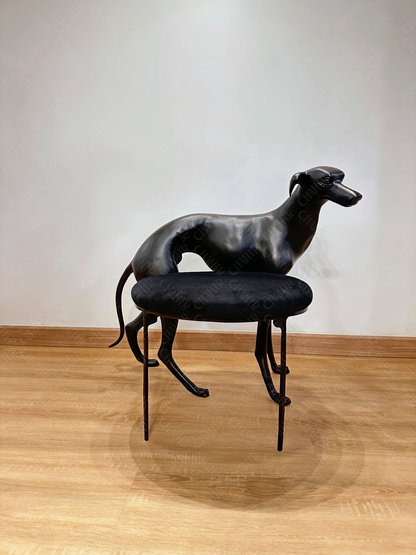 Black dog-shaped chair with a black cushion on a wooden floor. Luxury Modern Furniture