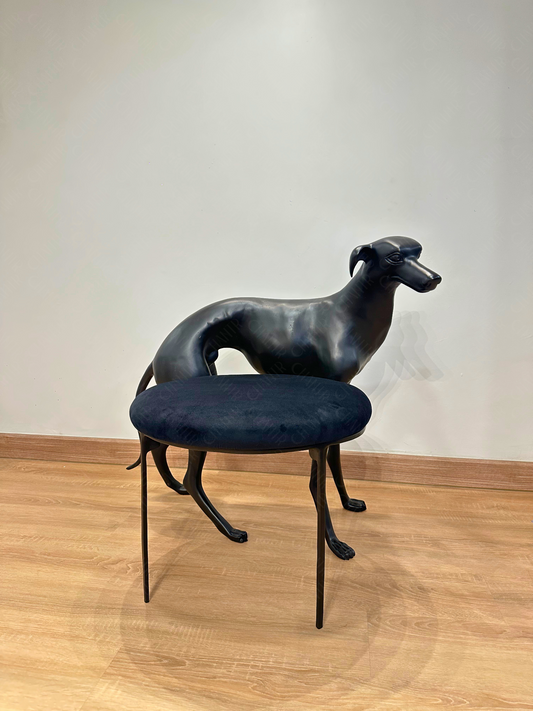 Black dog-shaped chair with a black cushion on a wooden floor. Luxury Modern Furniture