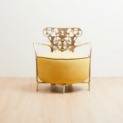Decorative gold brass luxury handmade furniture chair with intricate metal frame, and yellow cushion ideal for modern luxury decor, on a white background. - straight angle