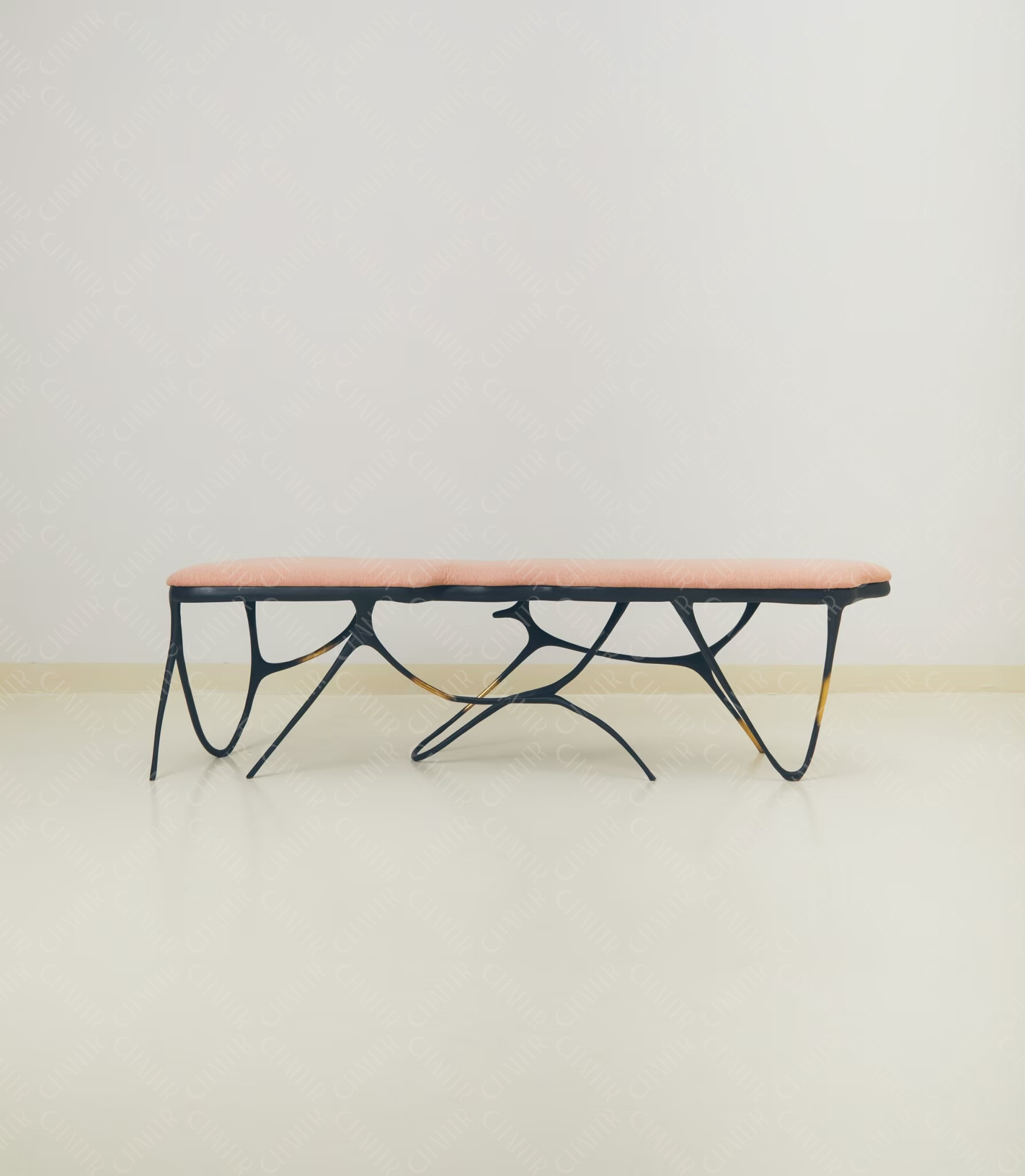Modern luxury handmade furniture coffee table with black metal frame and pink top, brass furniture accents, perfect for modern luxury decor, on a plain background.