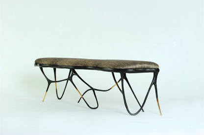 Black brass luxury handmade furniture bench with brown pattern cushion with modern design, ideal for modern luxury decor, on a white background. Side angle