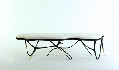 Black brass luxury handmade furniture bench with white cushion with modern design, ideal for modern luxury decor, on a white background.