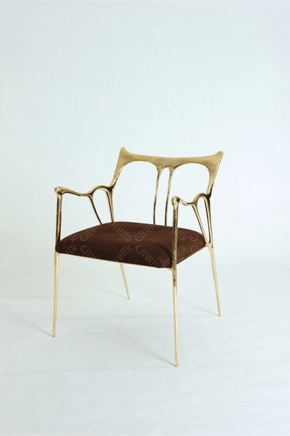 Gold brass luxury handmade furniture chair with brown cushion, ideal for modern luxury decor, on a wooden floor.
