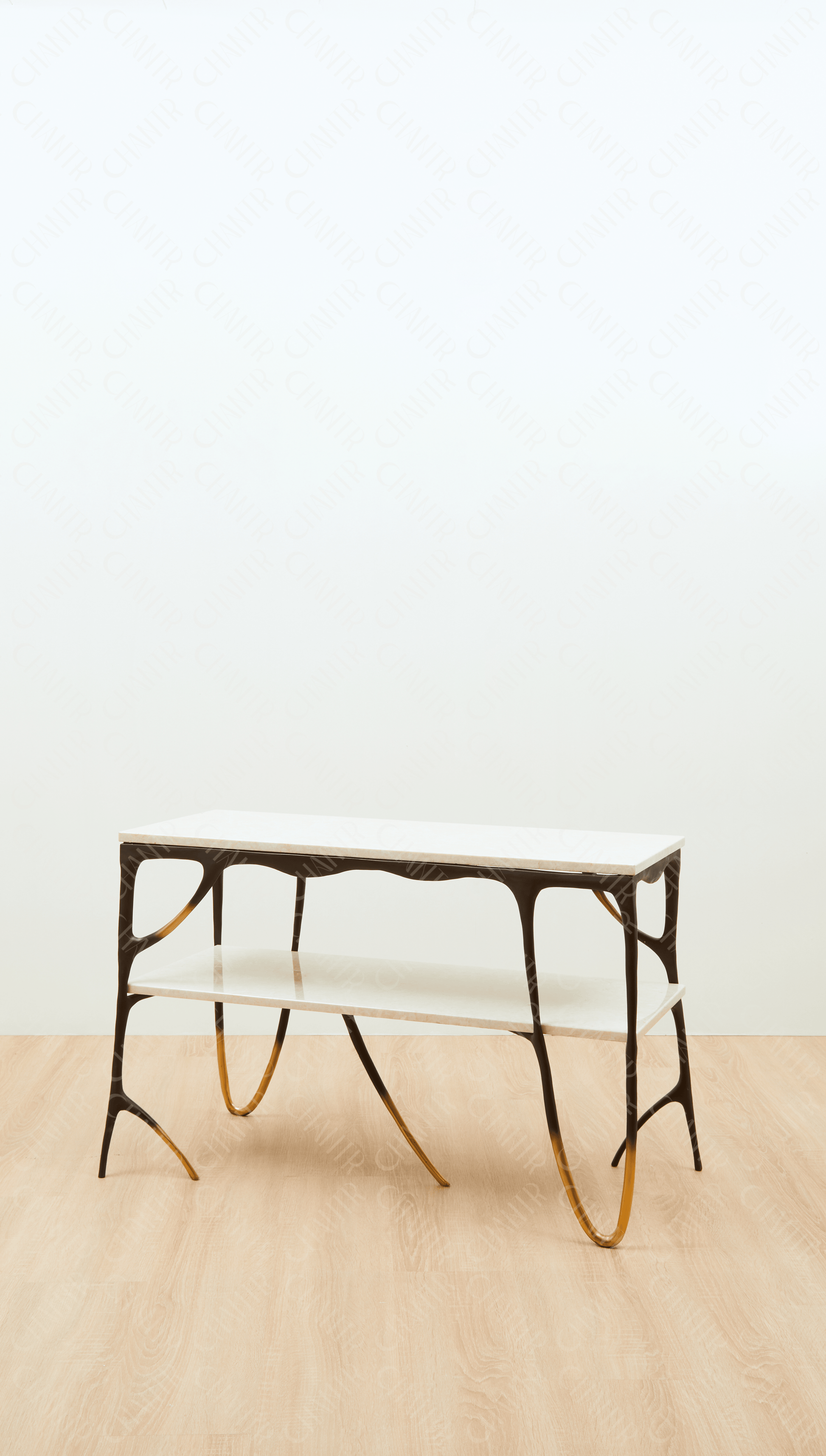 Modern black brass luxury handmade furniture console table with gold tips and two marble accents, perfect for modern luxury decor, on a plain background.