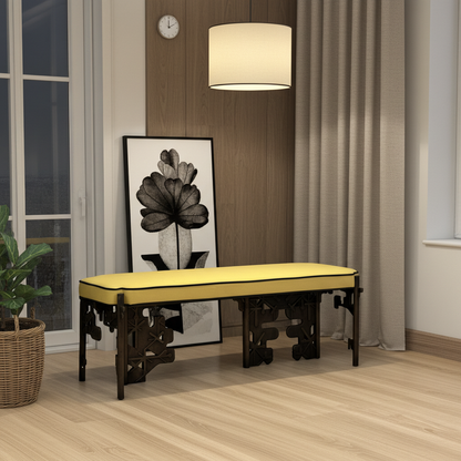 Luxury handmade brass bench with yellow cushion in a room with a clock, lamp, and plant.
