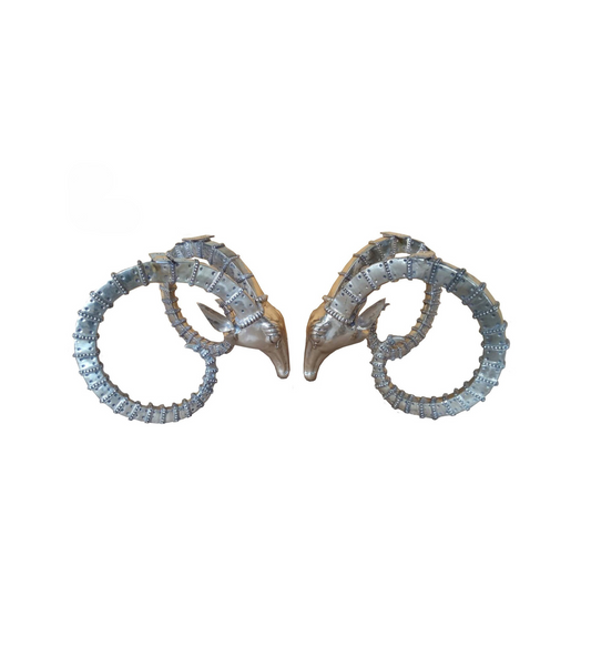Pair of luxury handmade furniture table bases resembling deer heads with antlers, perfect for modern luxury decor, on a white background.