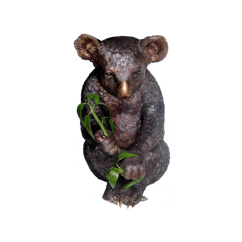 Luxury handmade furniture statue of a koala bear holding a branch, perfect for modern luxury decor, on a white background